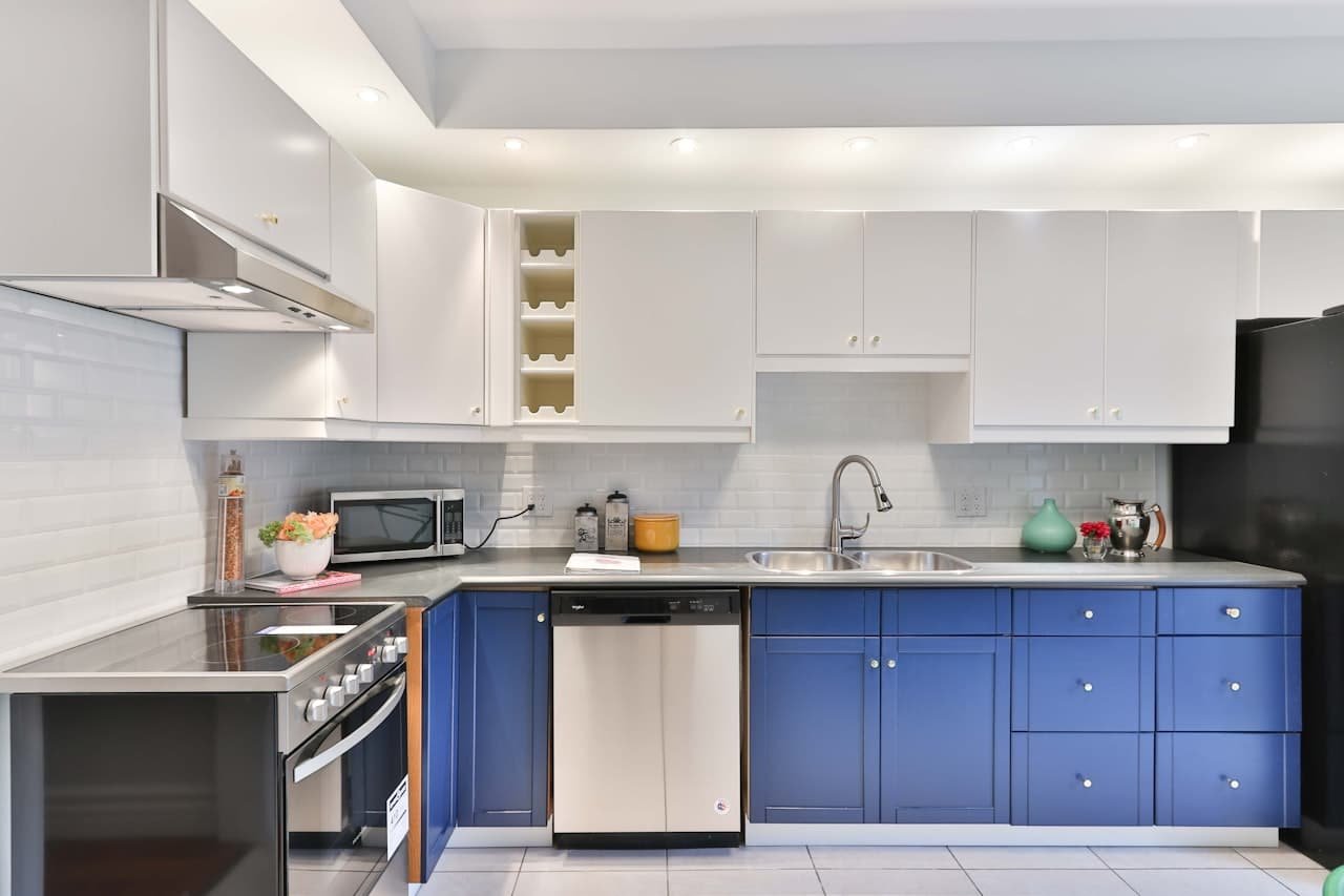 Kitchen with freshly refinished blue cabinets