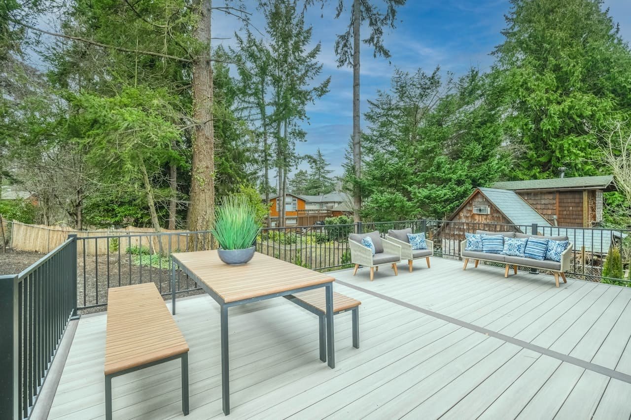 Wooden backyard deck with patio furniture