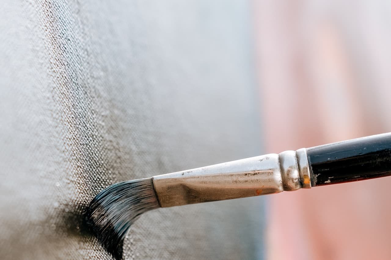 Brush cutting a clean line where wall meets trim