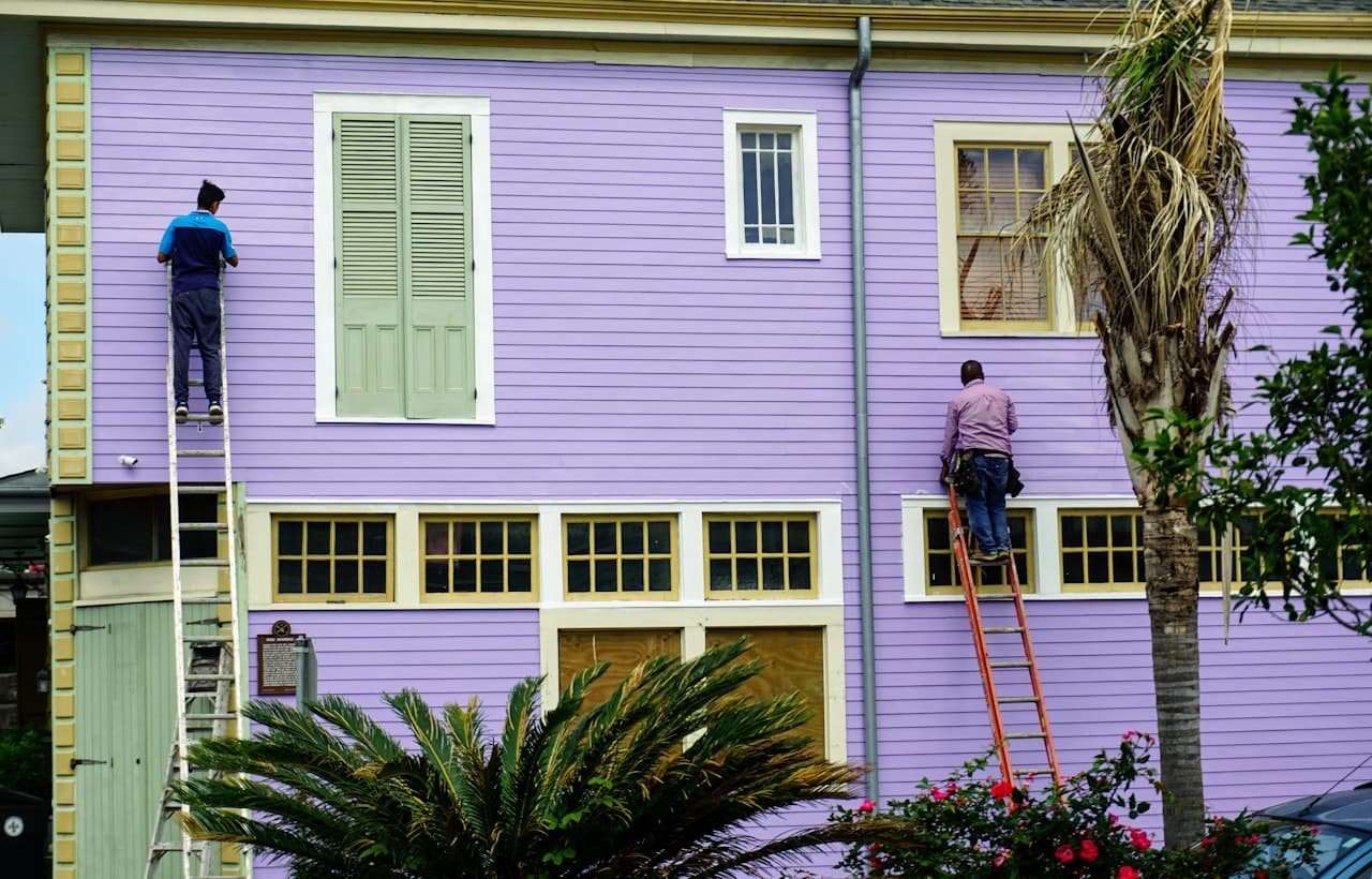 Painter working on the exterior of a house