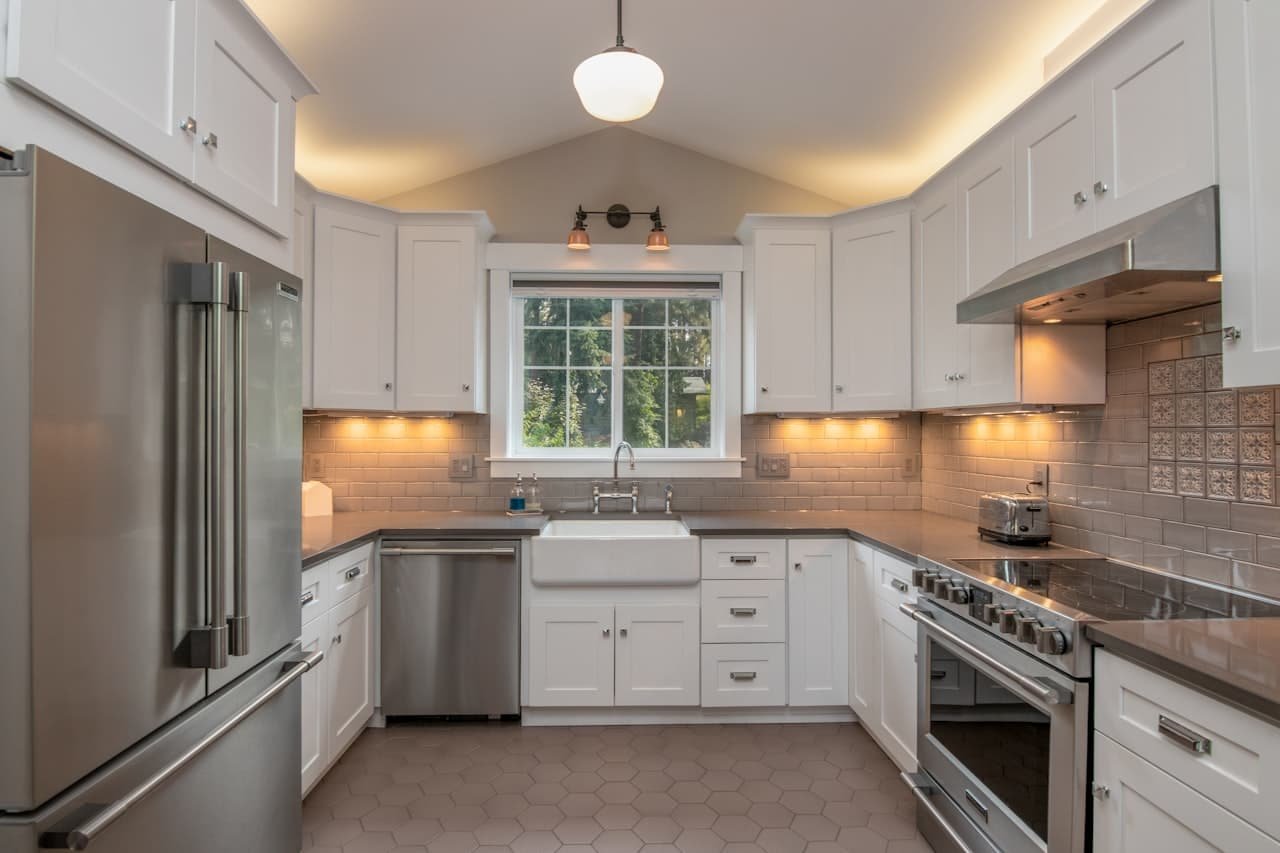 Kitchen with newly sprayed white cabinets